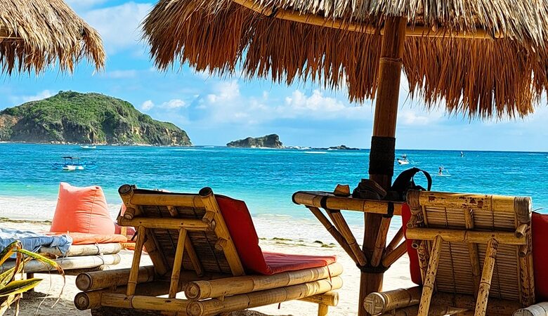 Beach umbrellas and loungers at Tanjung Aan Beach Lombok