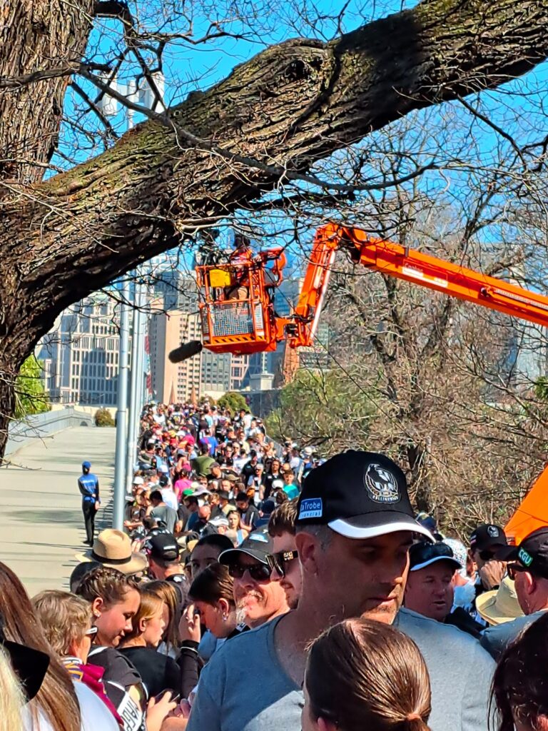 Praying at the AFL Altar at the the Grand Final Parade