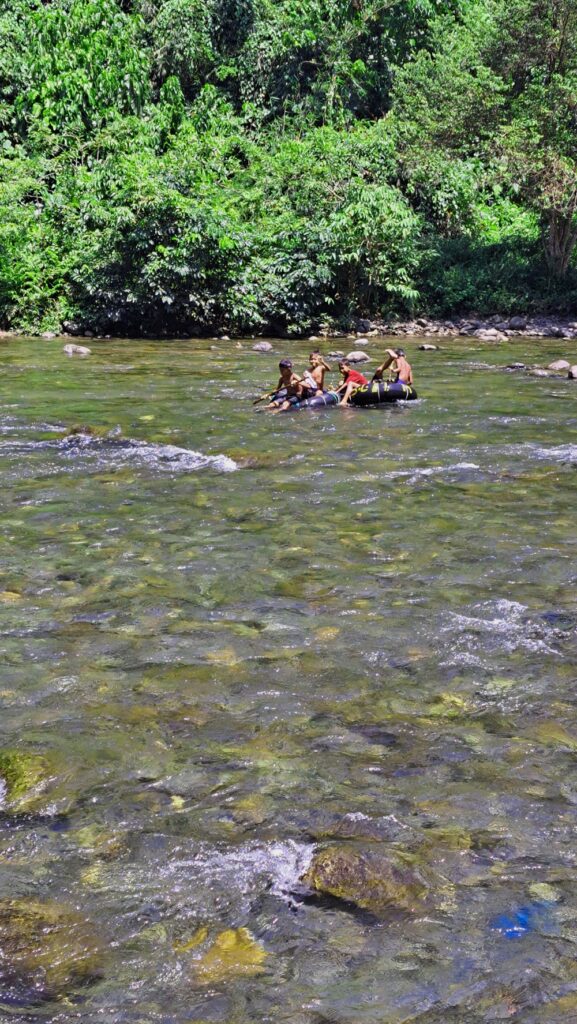 Kids in tyres on Bohorok River